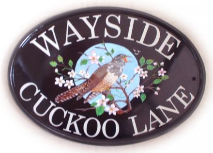 Cuckoo in blossom branch - Painted on a New World Classic Oval base plaque with Century Schoolbook font. Painted by Jean from her own design. 