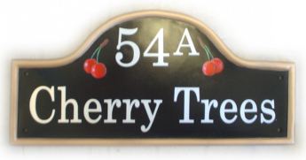 Cherry Trees sign - the customer wanted just a few cherries on each side of the house number. Painted on a large black mews plaque with a gold painted rim