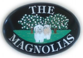 Magnolia and dog - Painted on a New World classic oval base sign . The customer sent us some photos of their dog and asked for the dog to be standing in front of the magnolia bushes. Font is called Tiffany. Artist - Gerry