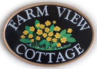 Yellow primroses sign -  Painted on a New World classic oval base with a gold rim. The font is called Goudy Handtooled