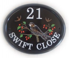 Swift on a Hawthorn branch. The customer sent us a picture of the swift to be painted in the pose shown on the plaque. Painted on a Large classic oval by Jean. Font is called Century Schoolbook.