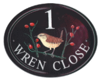 Wren - artwork from book on birds - painted on a large classic cast oval. Font is Times Roman. painted by Gerry
